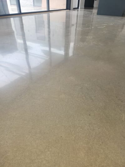 Older concrete slab being patched and levelled before polishing